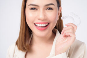 woman with aligner
